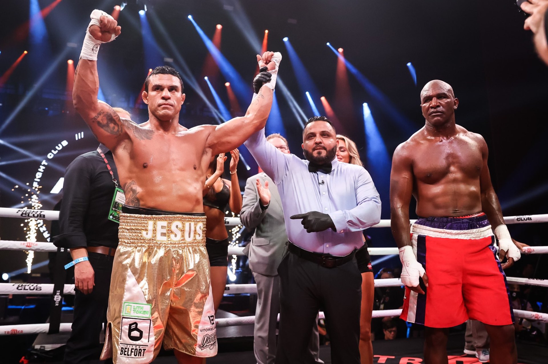 Coach Derik Santos raising Vitor Belfort's hand in victory at Triller Fight Club